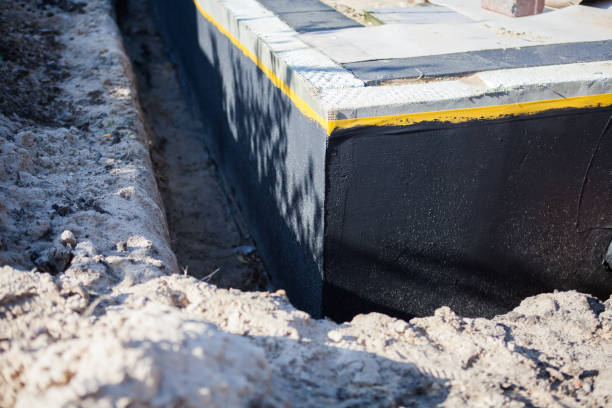 Professional Basement Waterproofing technician working in Fort Lee, VA